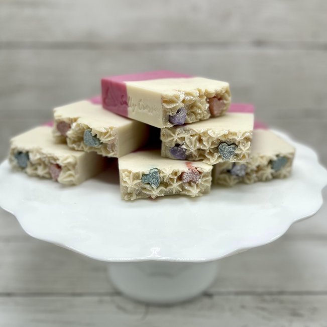 stack of candy heart artisan soaps on white cake stand