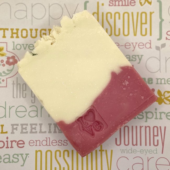 heart to heart artisan soap stamped with "love" on the bar face