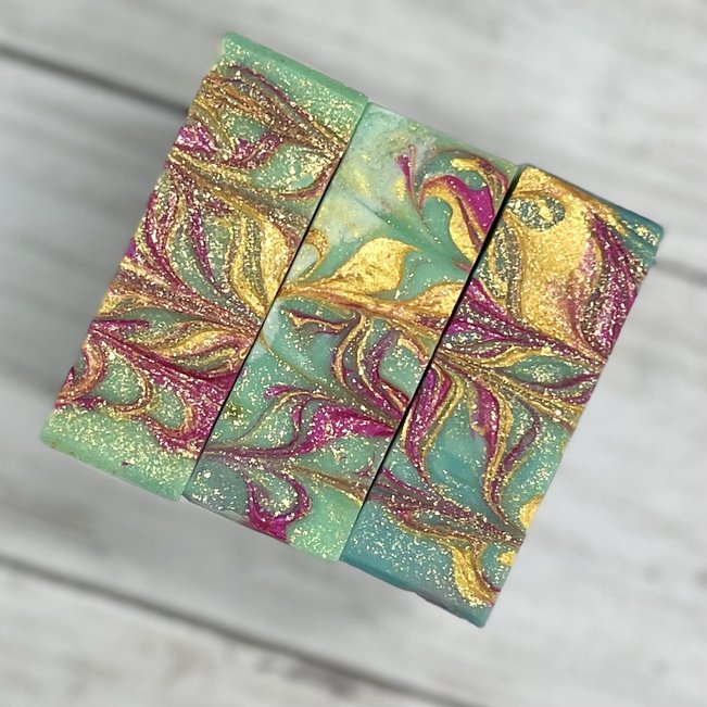 pink and gold swirled soap top close up