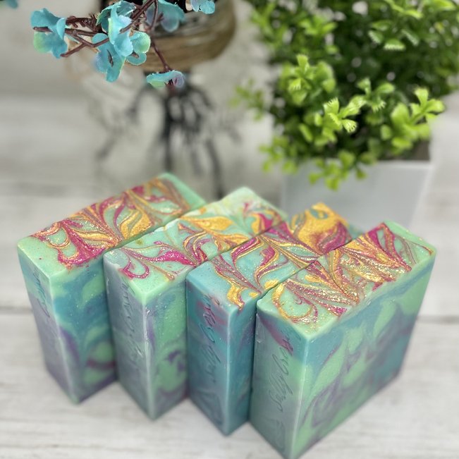 blue swirled soap with pink and gold top unscented coconut milk soap