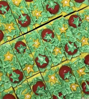maters on the vine artisan soap close up of hand sculpted soap tomatoes, vines, and flower blossoms