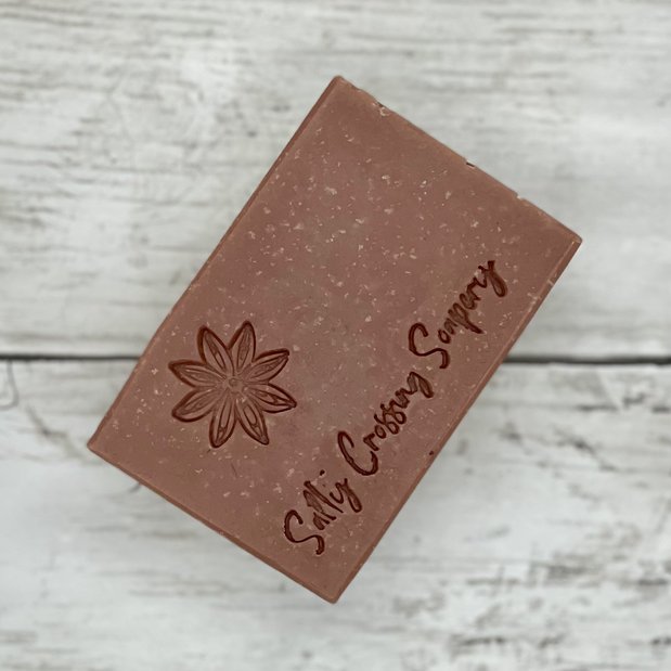 coconut milk soap stamped with star anise design and Salty Crossing Soapery