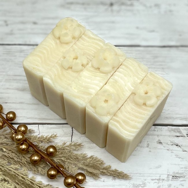 row of white soaps with fancy flowers piped on top