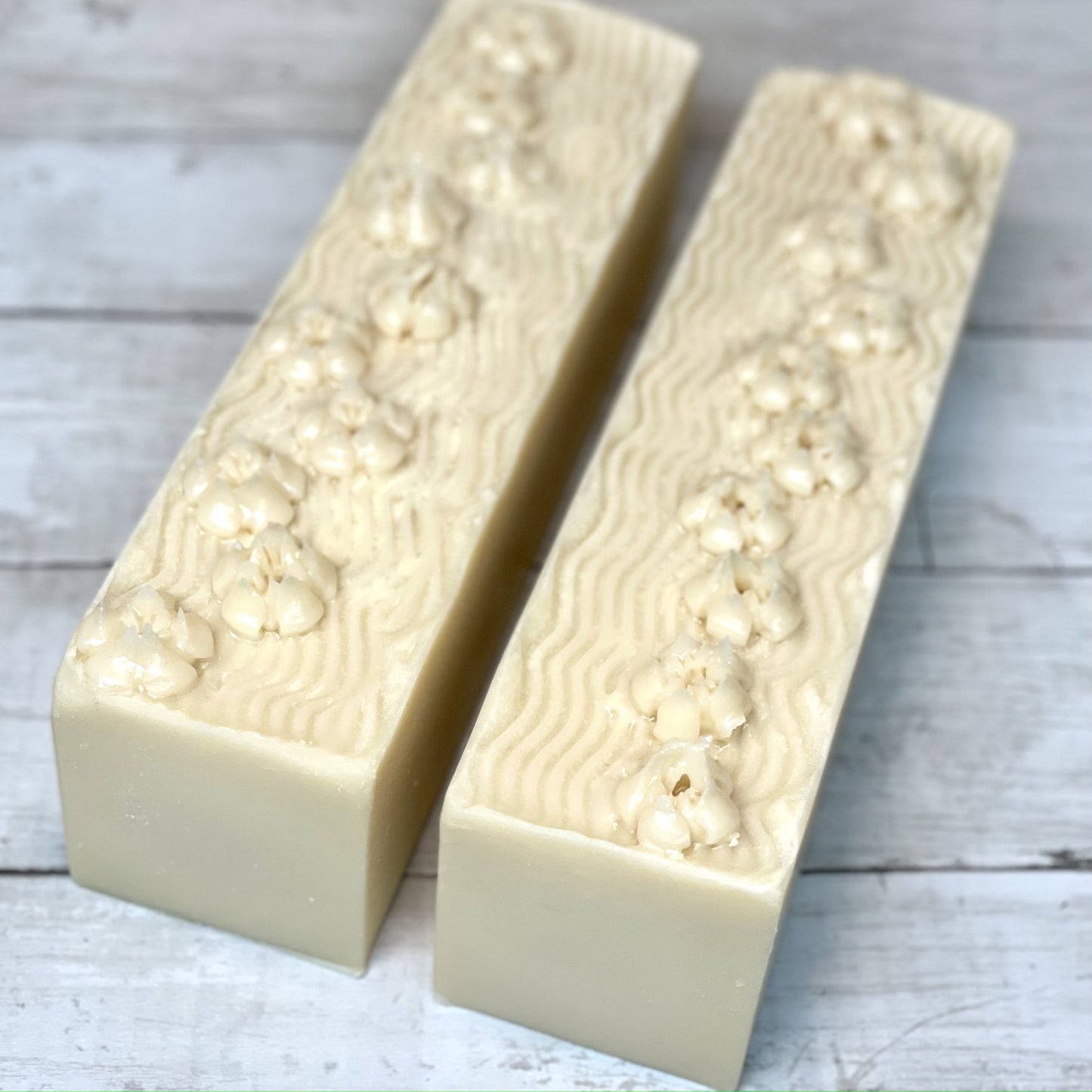 fancy soap loaves with flowers piped on top