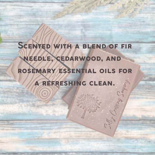 Photo of goat milk soaps with text: scented in a blend of fit needle, cedar wood, and rosemary essential oils for a refreshing clean
