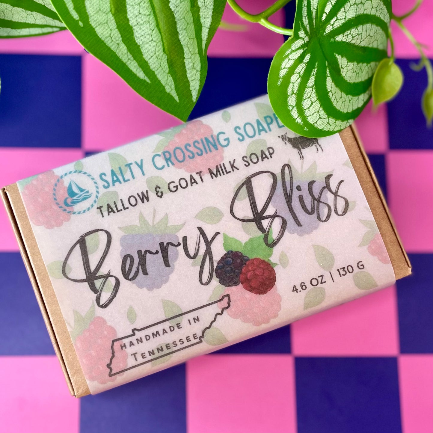 Bar of soap with 'Salty Crossing Soap' branding on a colorful checkered background