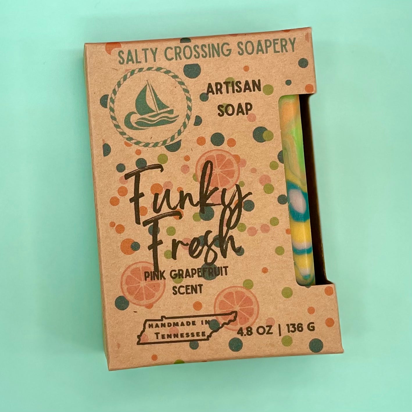 Salty Crossing Soapery artisan soap packaging on a light green background