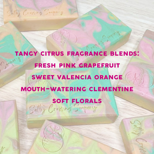 swirly design soap bars with text that reads "tangy citrus frangrance blends fresh pink grapefruit, sweet valencia orange, mouth-watering clementine, and soft florals"