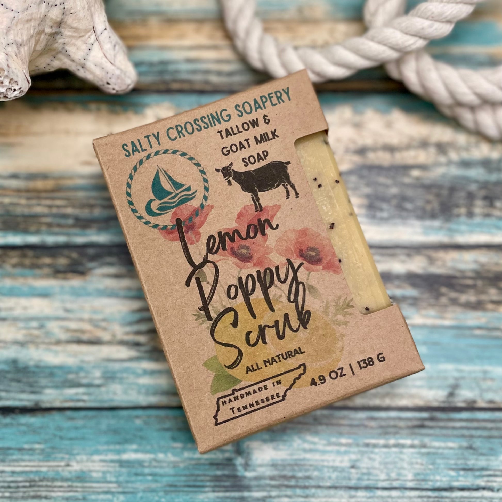 Bar of soap with a 'Salty Crossing Soapery' label on a wooden surface.