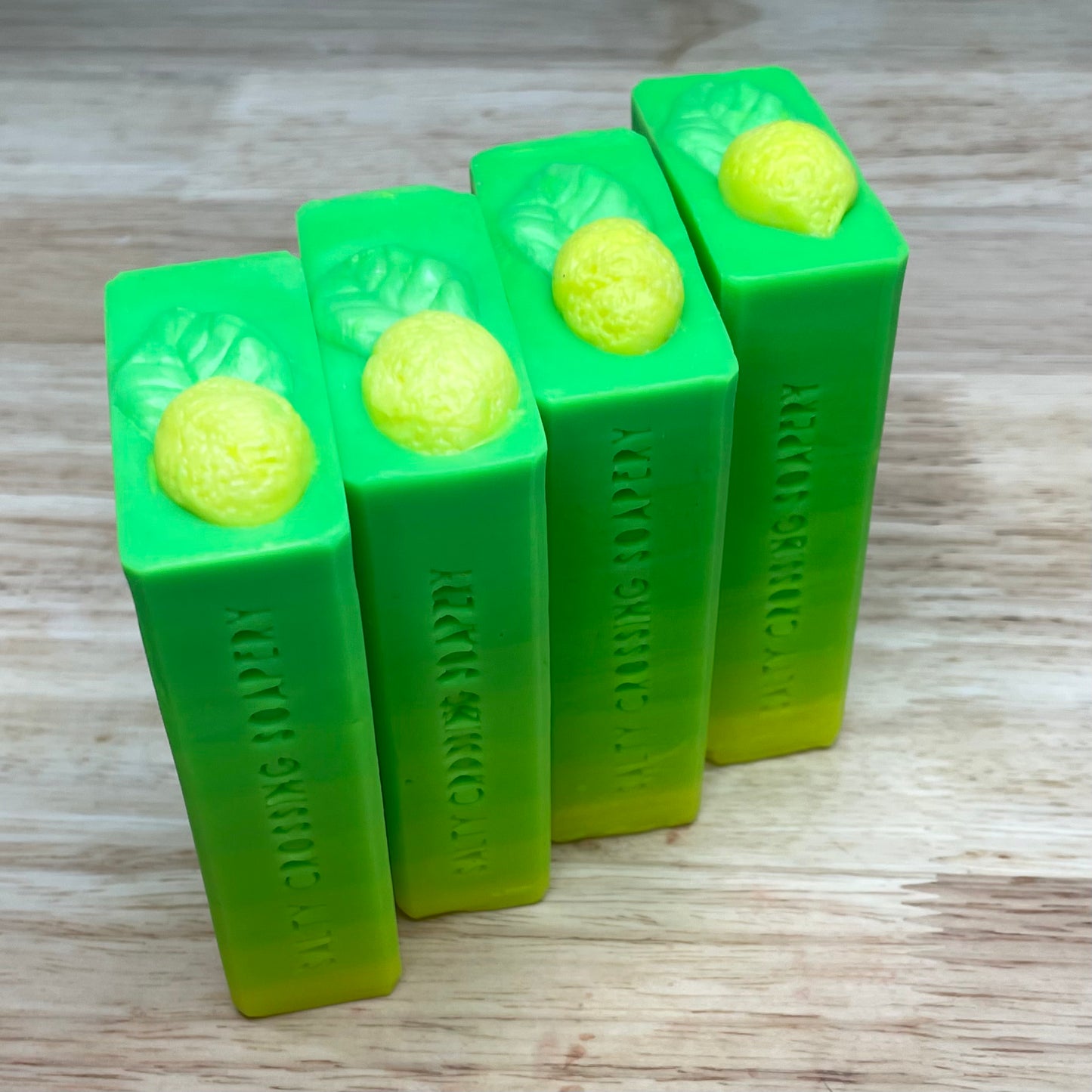 Lemon soap bars stamped with Salty Crossing Soapery on the side