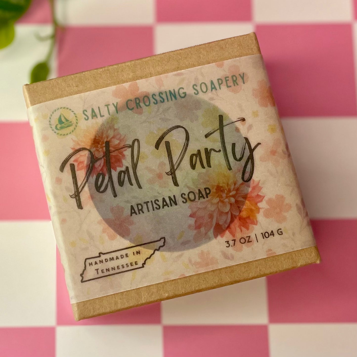 Artisan soap bar packaging with 'Salty Crossing Soapery' branding on a checkered background.