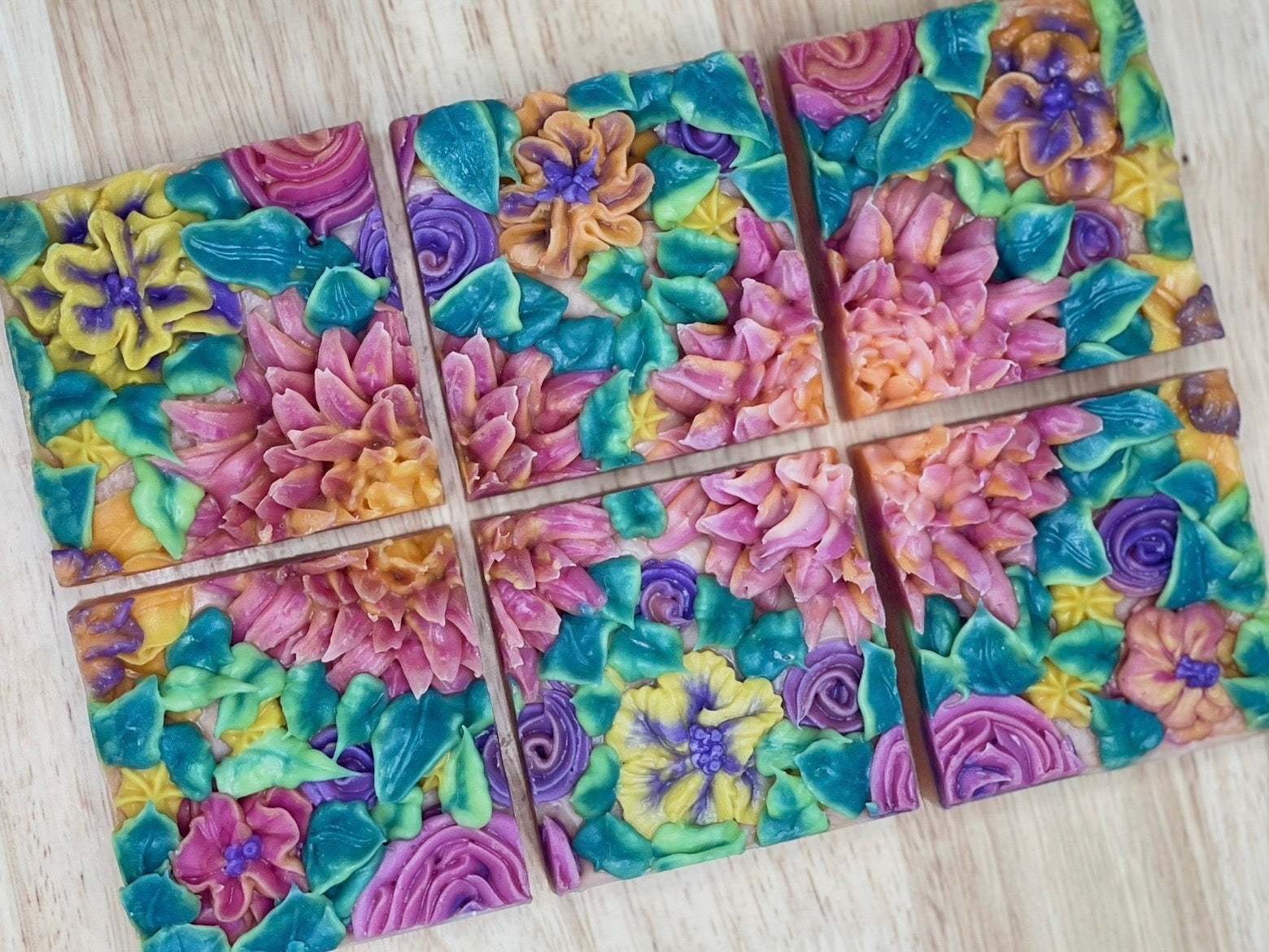 Colorful floral patterned soap on a wooden surface