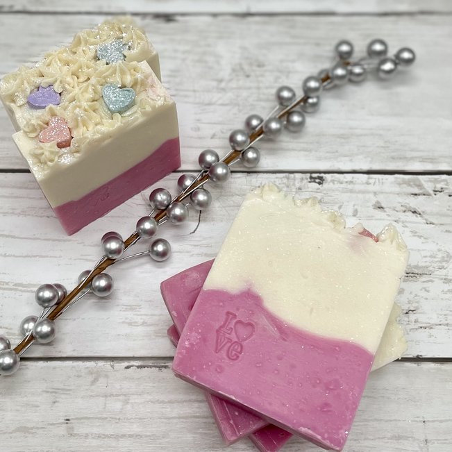 artisan soap with candy heart soaps on top stamped with love