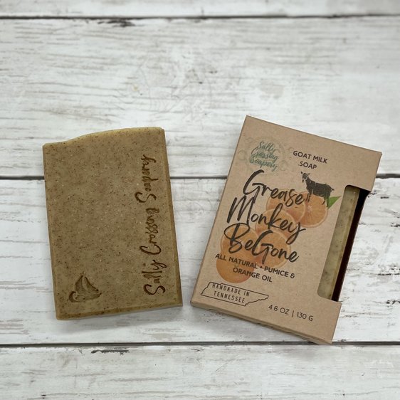 Grease monkey mechanic goat milk soap with box. Orange soap stamped with small sail boat and text salty crossing Soapery