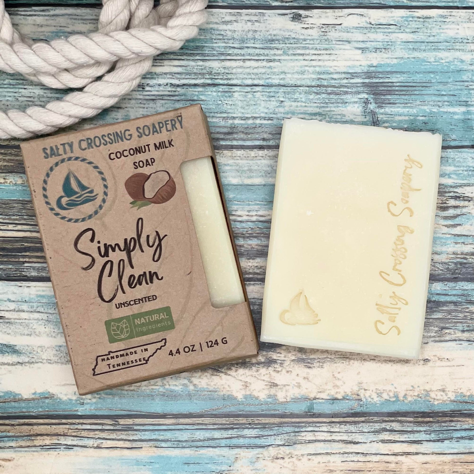 Simply clean soap bar with box pour white bar stamped with a small sailboat and text salty crossing Soapery
