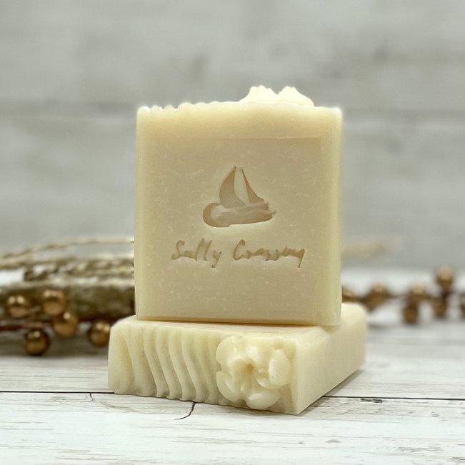 unscented coconut milk soap with sail boat and Salty Crossing brand stamped on front